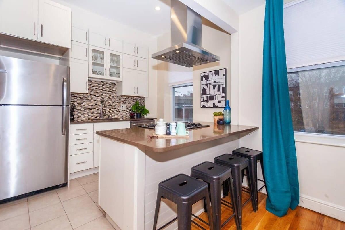 Expansive Essential Triplex Near T Boston